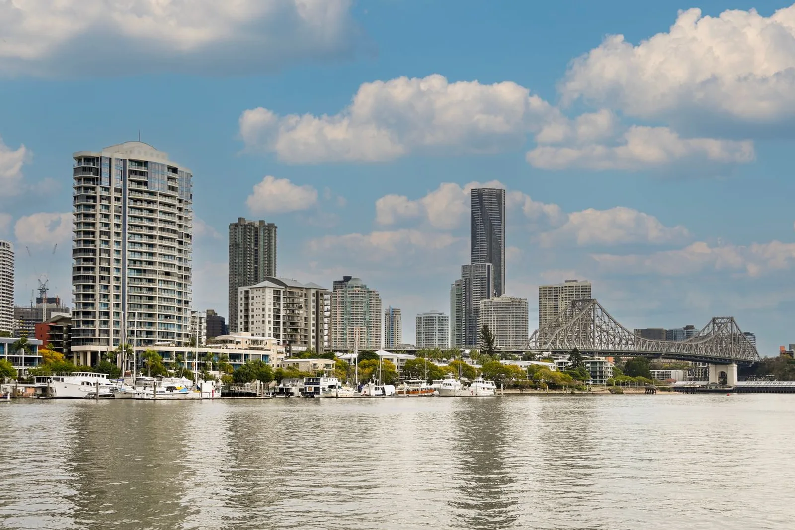 Brisbane skyline and Story Bridge seen across the river in daylight