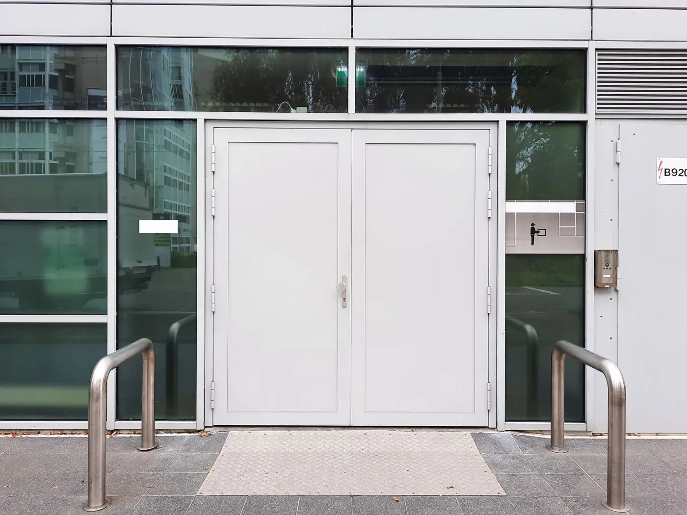 A modern commercial entry framed by full-height glazed panels.