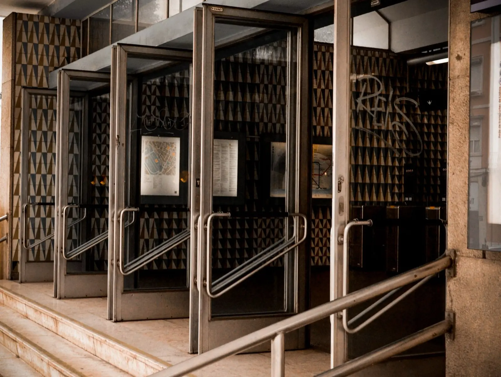 A glazed entrance with door glass and adjacent sidelight panels.