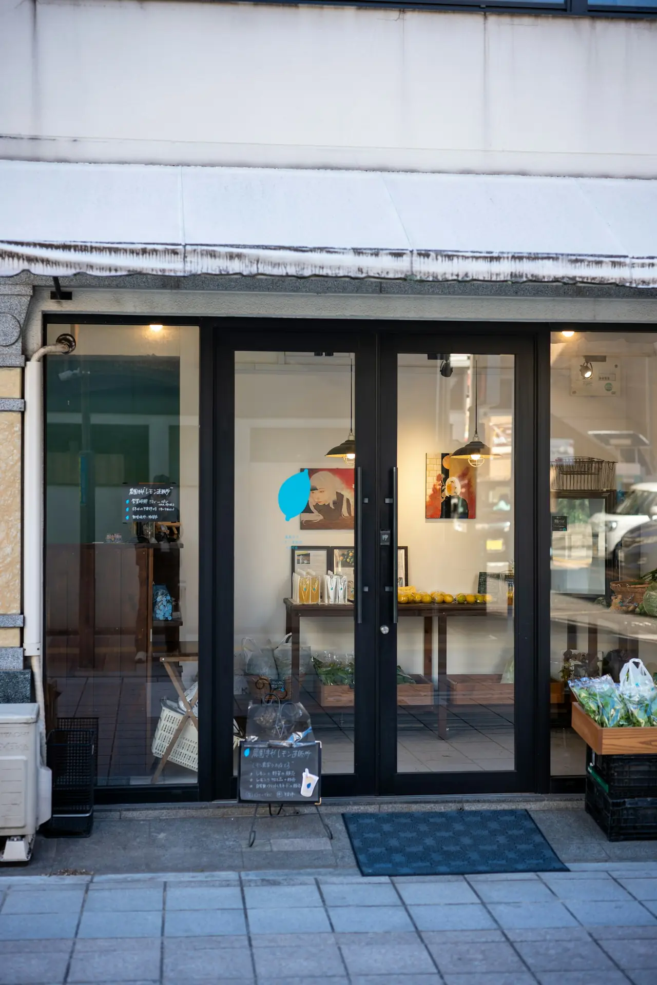 A finished retail shopfront with full-height glazed doors and display windows.